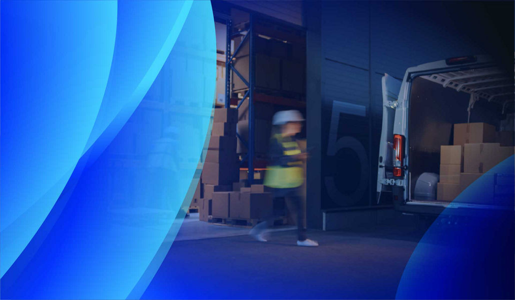 Warehouse workers loading a delivery van with IT assets