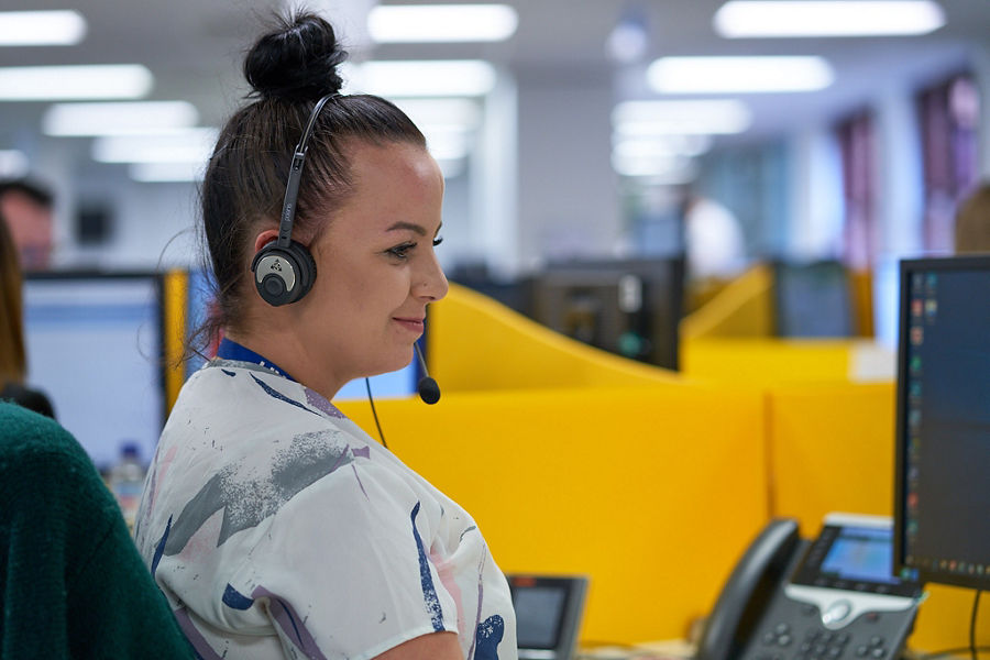 An employee using a headset 