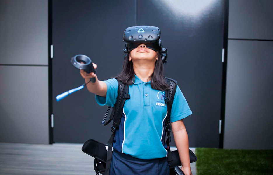 A child using a VR heaset and gesture remote