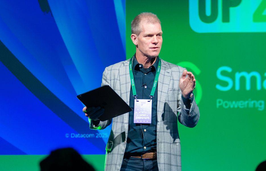 Datacom CEO Greg Davidson on stage