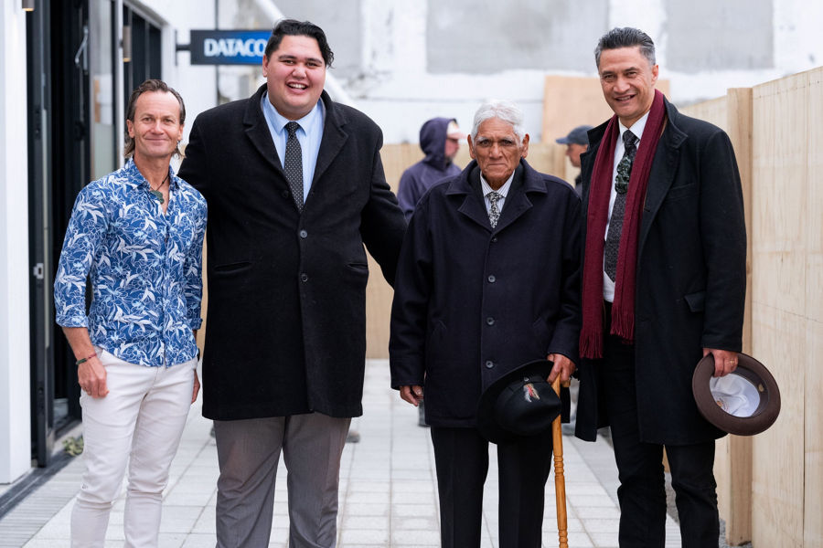 group of four suited men standing together including Hastings Mayor Sandra Hazlehurst