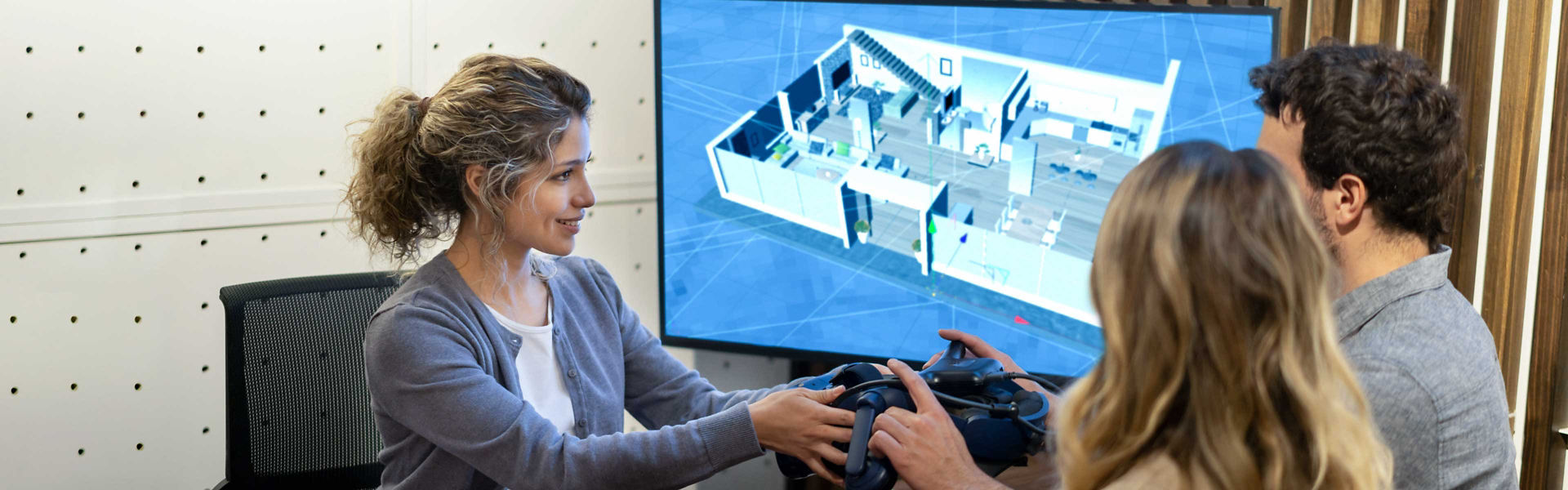 A female council worker having a discussion with a couple about AI