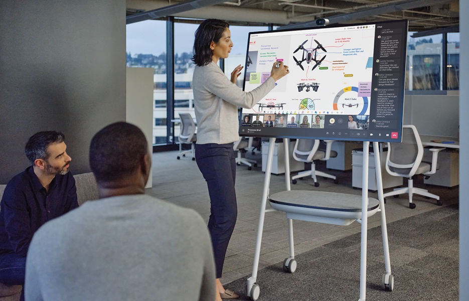 People collaborating on an interactive screen
