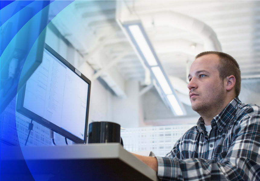 A male IT professional monitoring systems