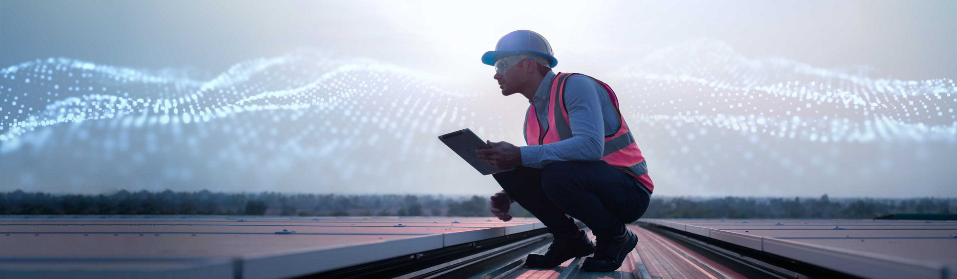 A solar power plant engineer examining photovoltaic panels