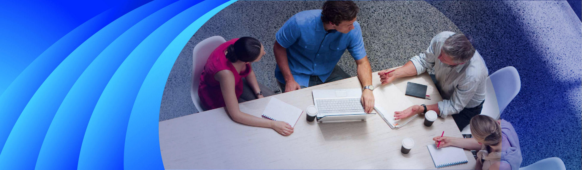 A group of people having a business discussion at an office table