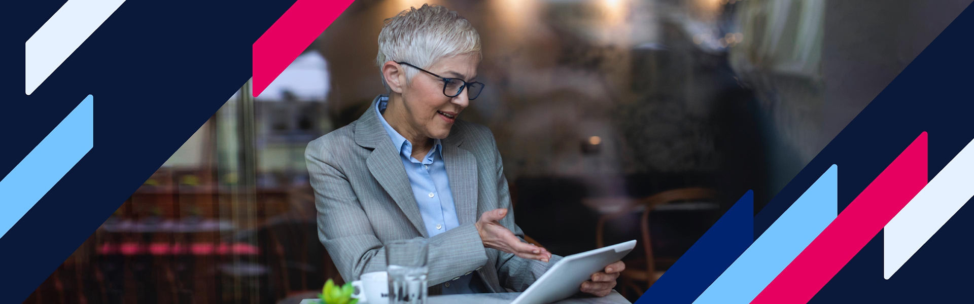Business woman using a tablet in a cafe