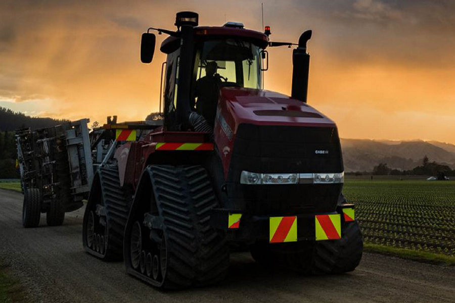 tractor with sunset behind