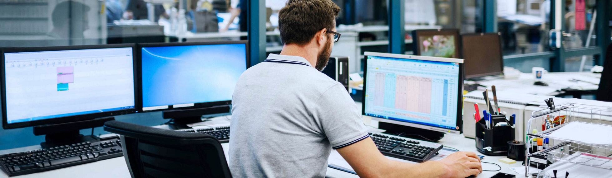 A product lifecycle management specialist reviewing a product spreadsheet