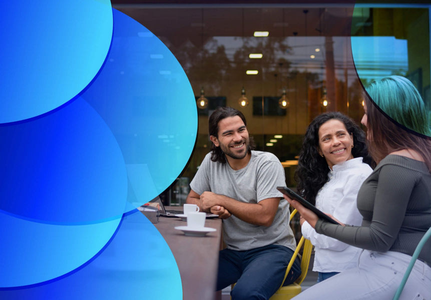 Two women and a man meeting at cafe with laptop