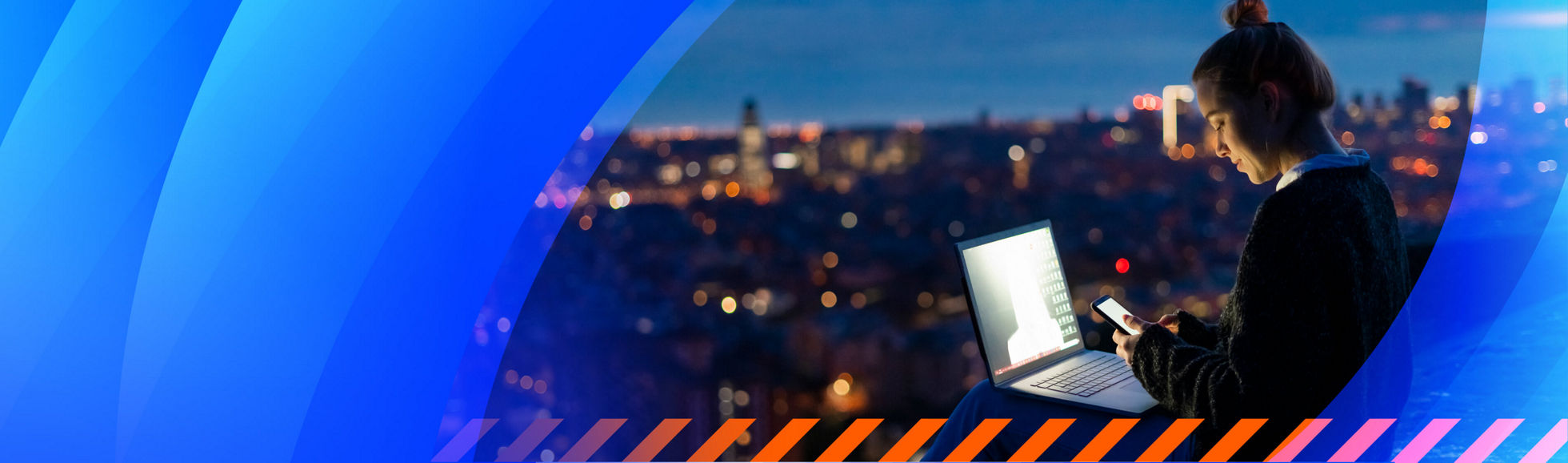 A young woman using a laptop in front of a city skyline 