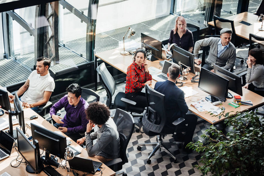 Group of people working in an open office landscape