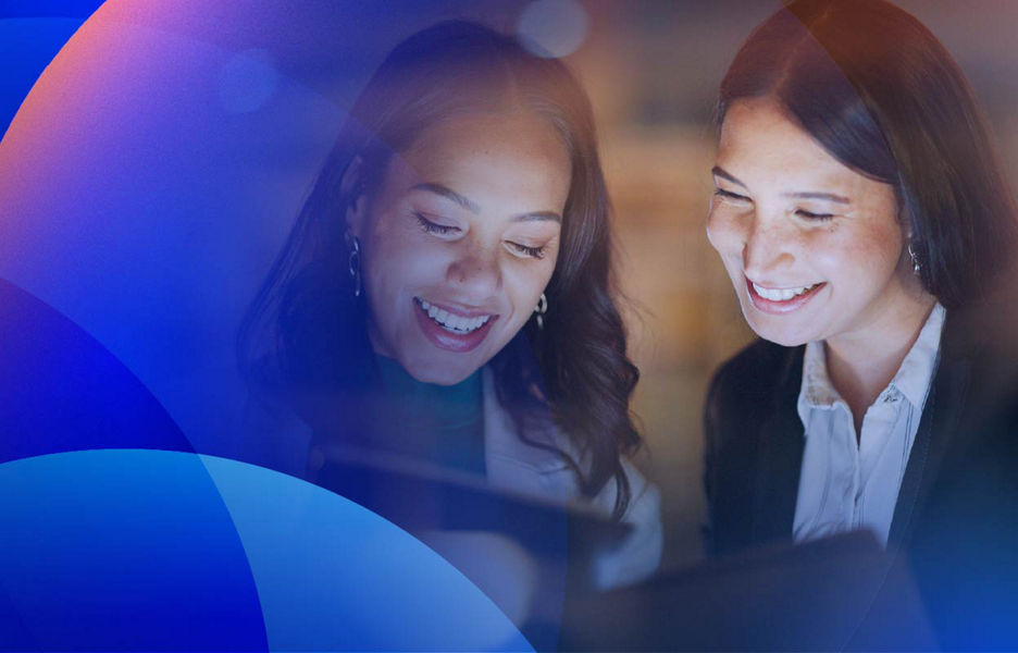Marketers reviewing campaign analytics on a tablet, using marketing automation tools to optimise customer journeys and engagement.