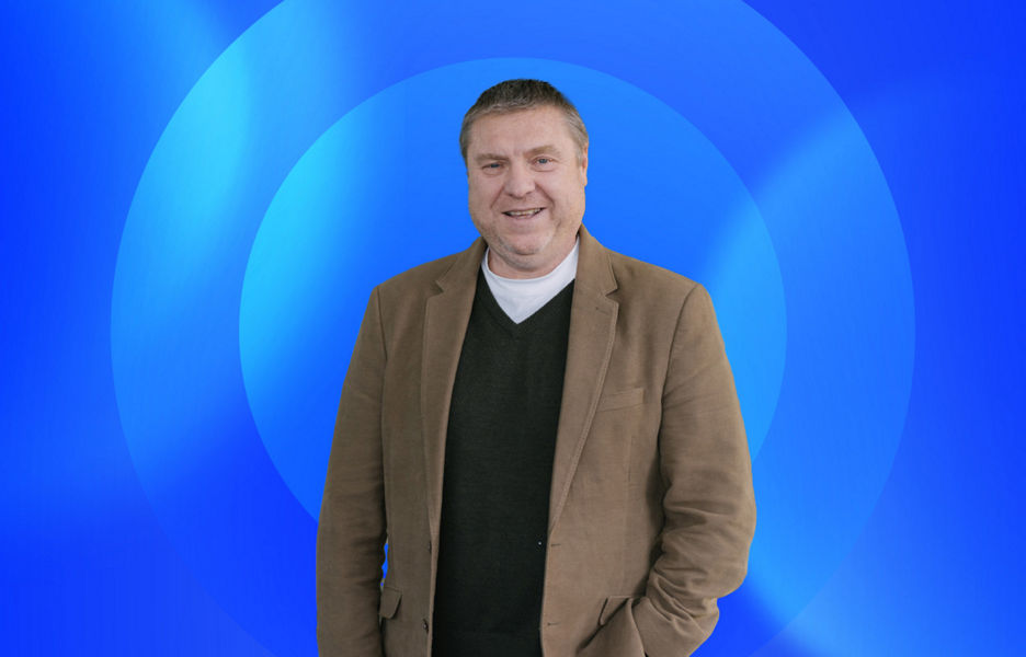Matt Neil with lens overlay on a blue gradient background