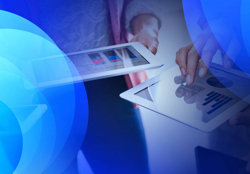 Two people reviewing analytics on tablets