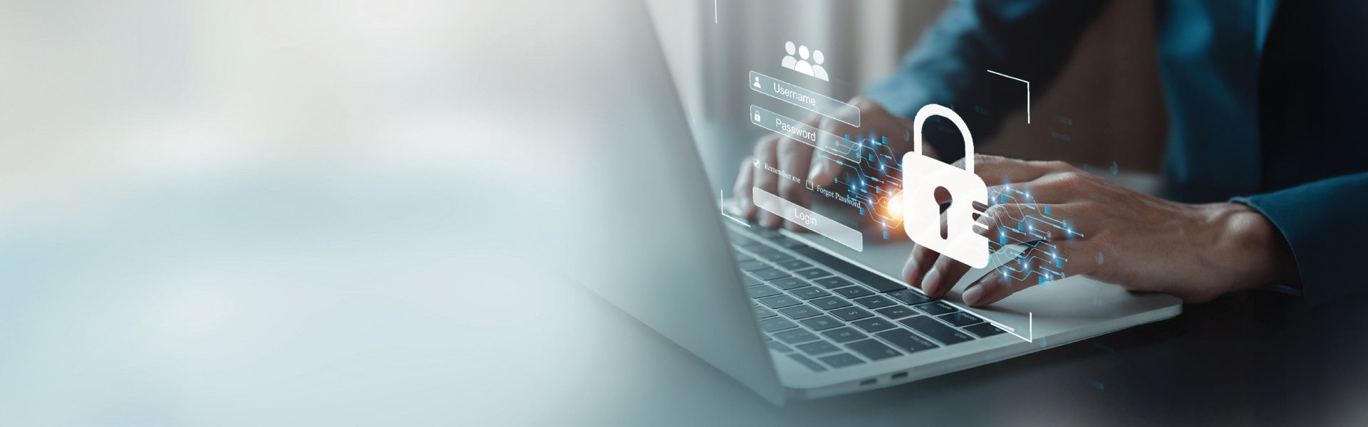 A man typing on a laptop with a lock hologram coming out of the screen.
