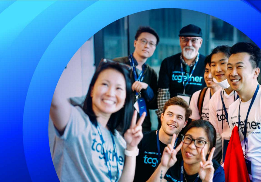 A group of smiling Datacom people at a community event