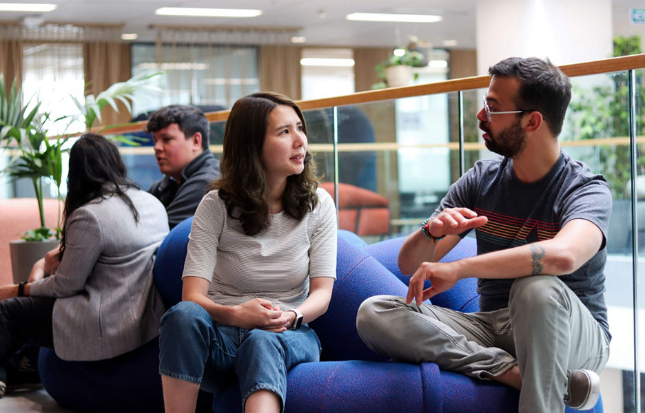 Datacom employees having a discussion