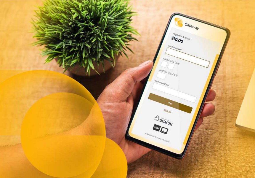 A phone with a Datacom Gateway branded payment page