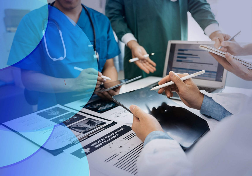 A medical team working on digital devices together at the hospital.