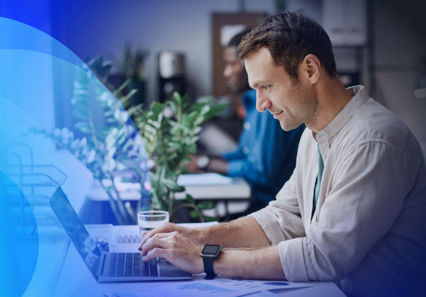 Product services team working on a laptop at a desk, supporting technology solutions and customer services.