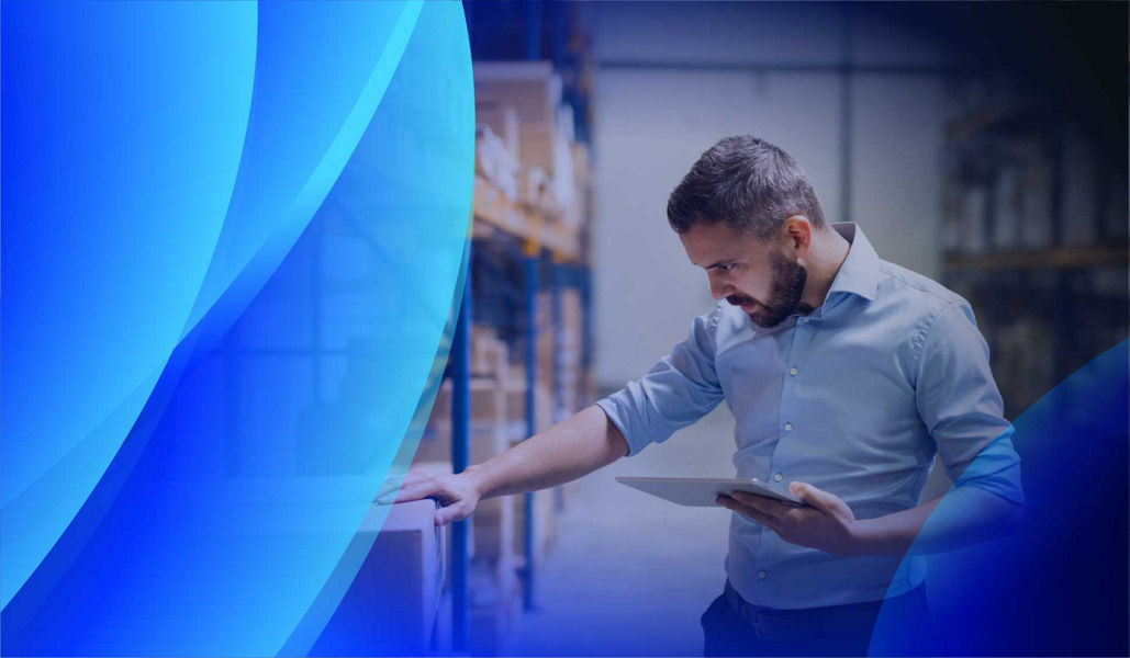 A project manager checking stock before it goes out for delivery