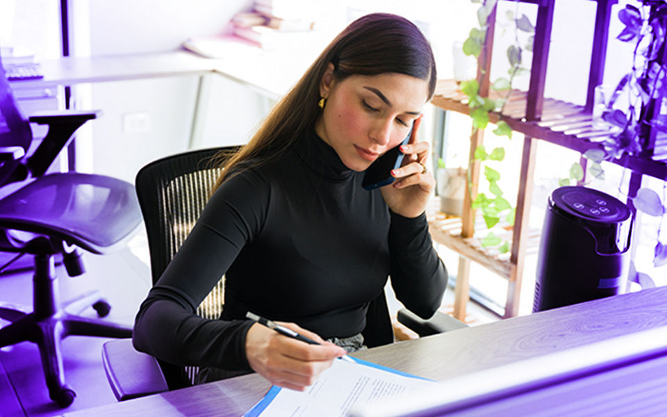 A young businesswoman reviewing compliance documents
