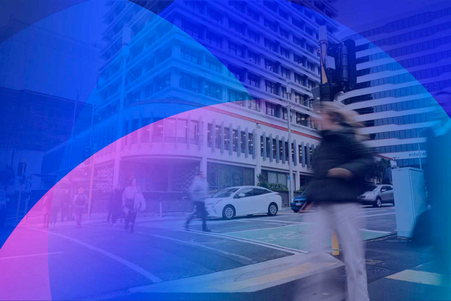 Wellingtonians walking outside of RBNZ's building