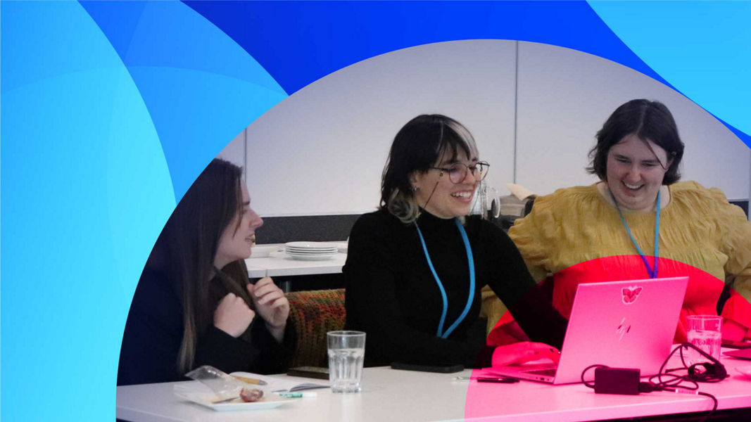 Three smiling graduates learning about Service Desk