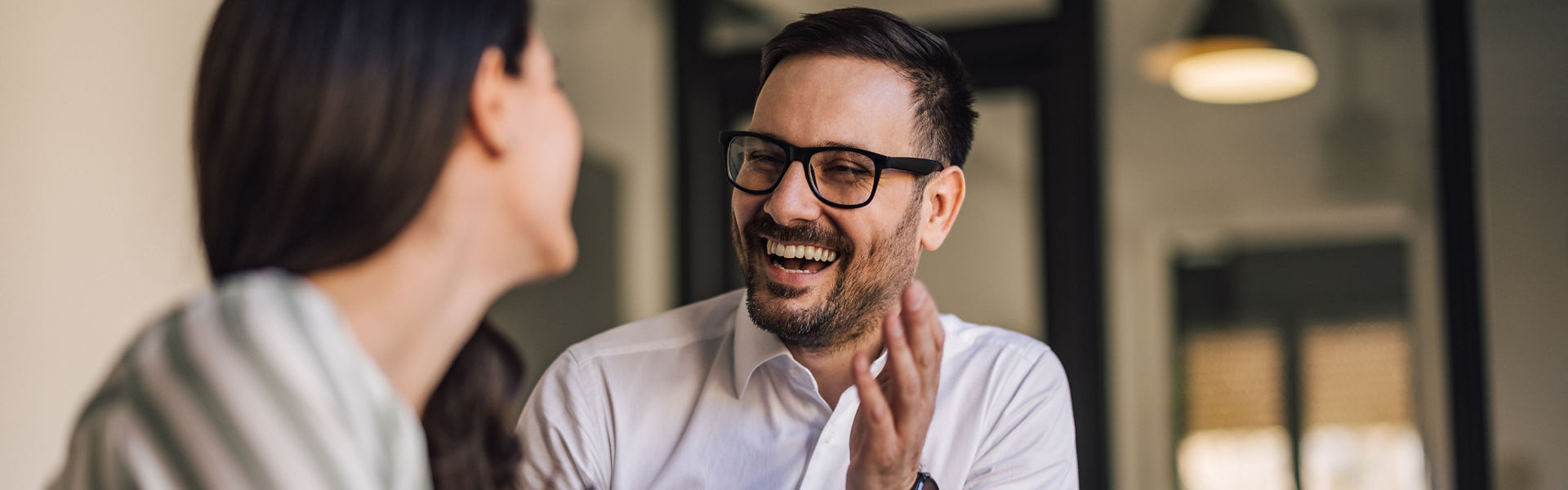 ServiceNow release cover image of corporate employees having conversation in office setting