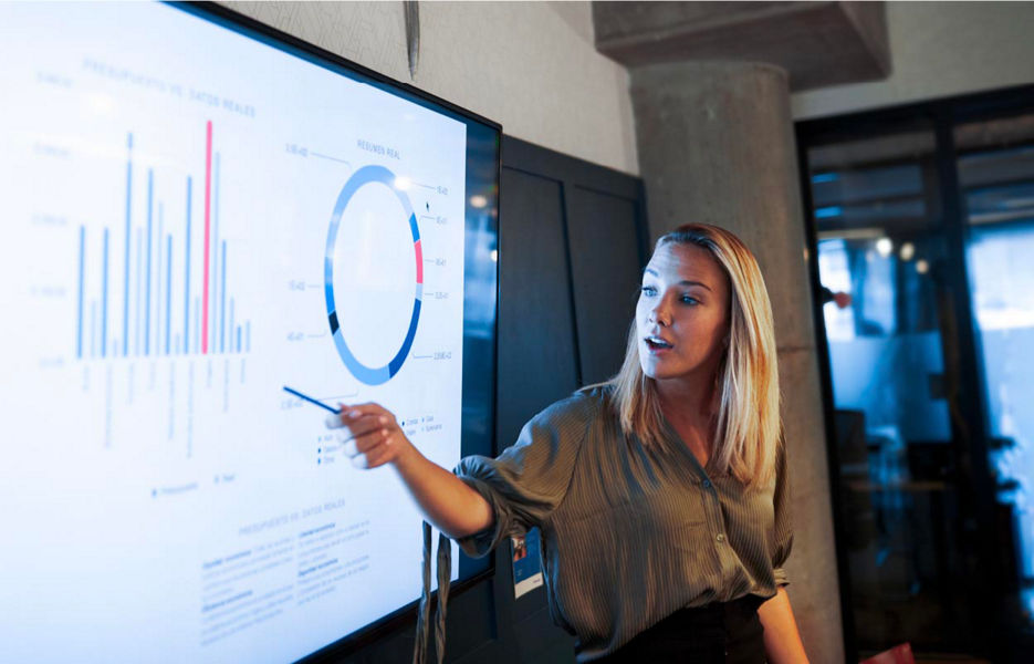 Woman presenting on a digital screen