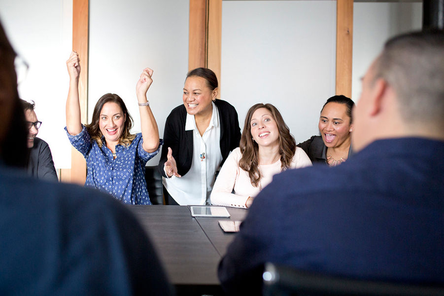 Group of office people cheering