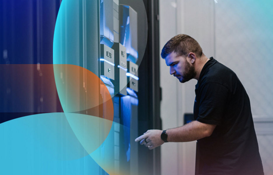 Person looking at a server tower at a data centre