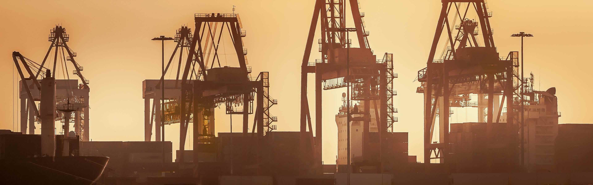 Industrial docklands skyline at dusk on the Yarra river, Melbourne.