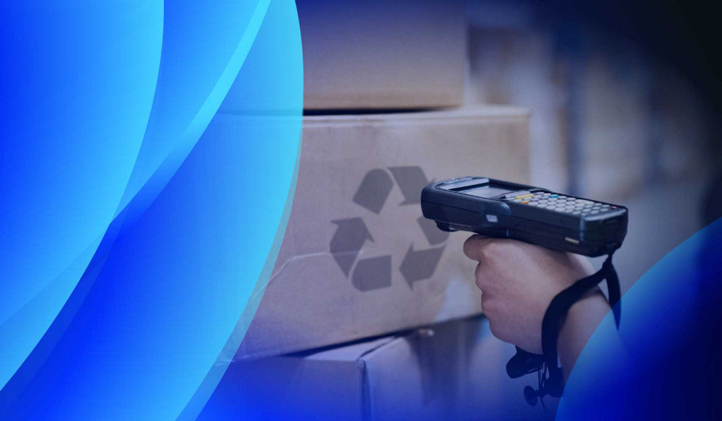 A person scanning a box with a recycling logo on it