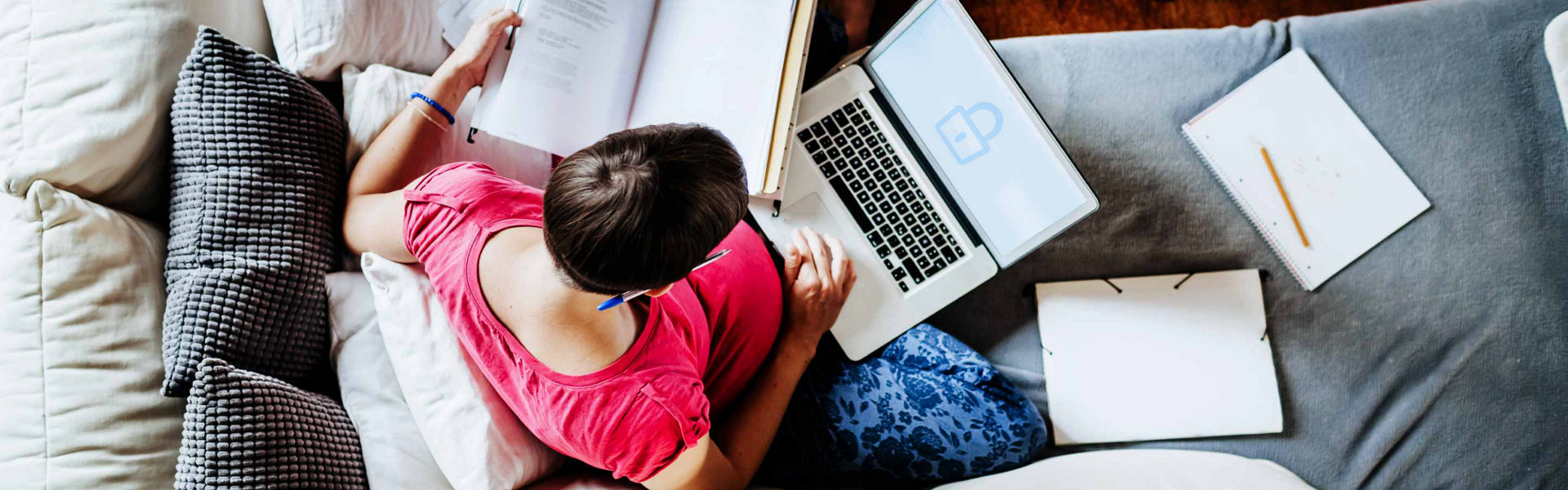 A woman working from home on a laptop with a lock icon on it