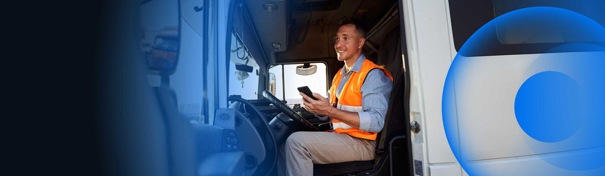 A smiling delivery driver sitting in a truck