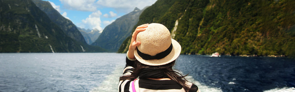 A person travelling in New Zealand on a lake