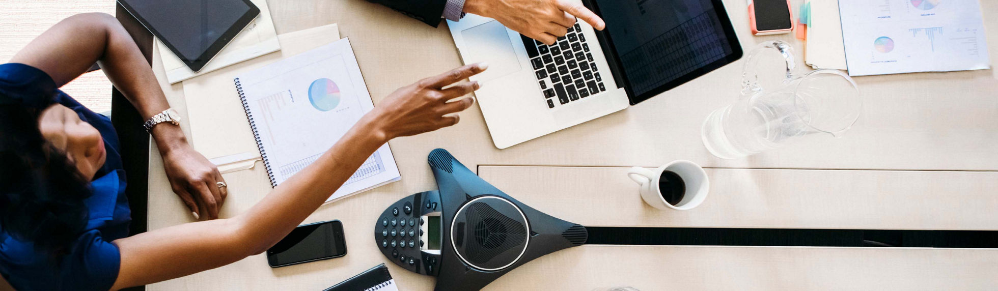 A person using a Cisco calling device in an office