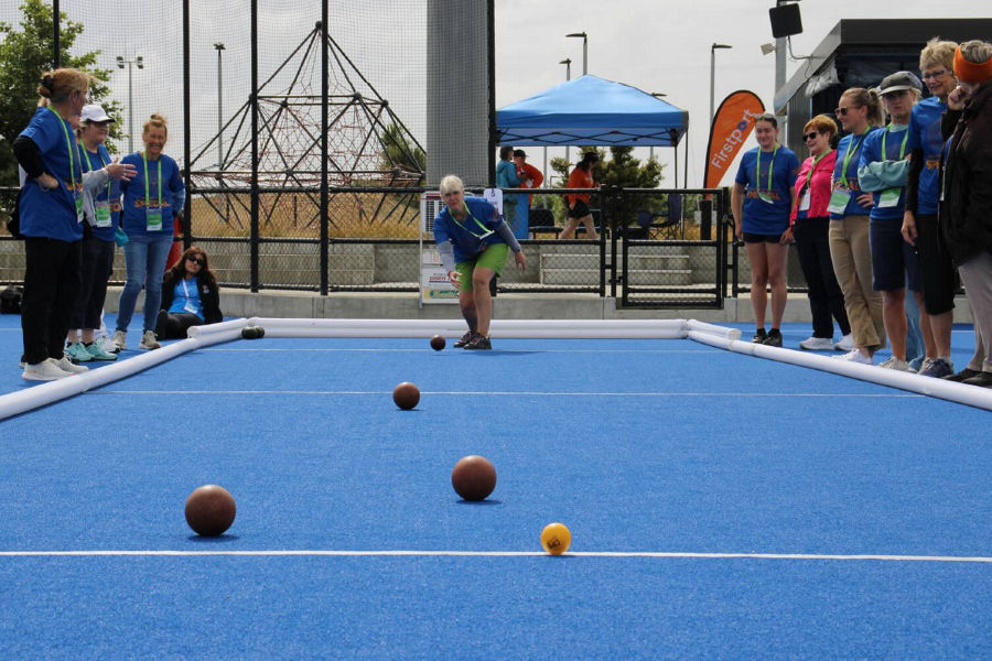 A group of people playing bocce