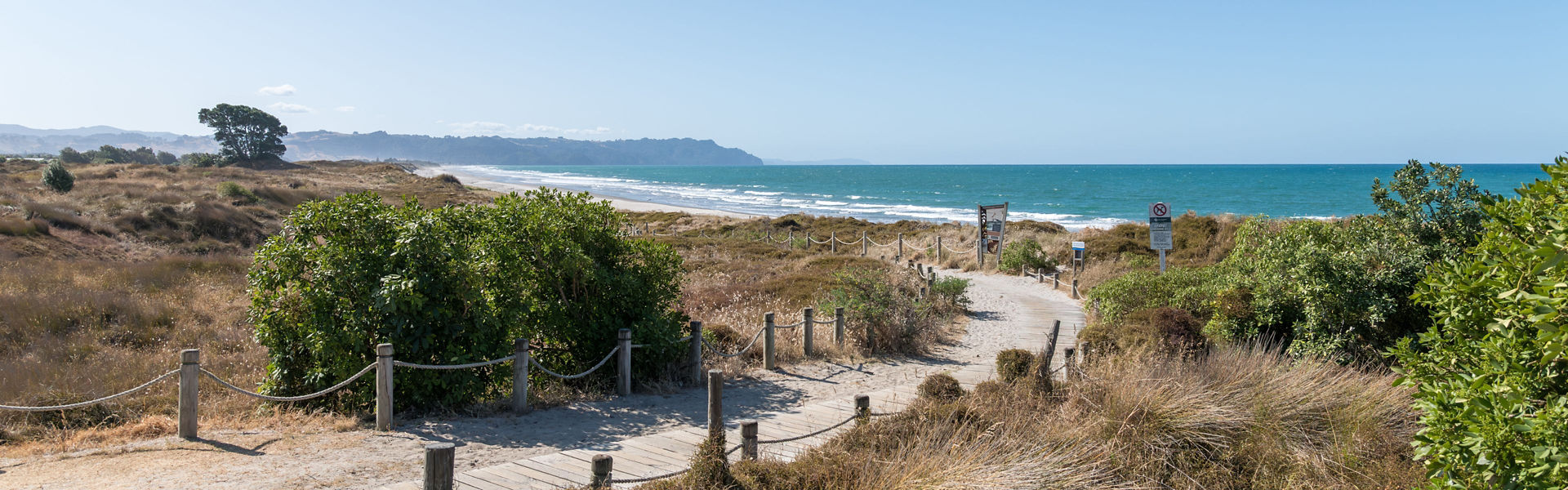 Path to Waihi Beach in Western Bay of Plenty district on a sunny day