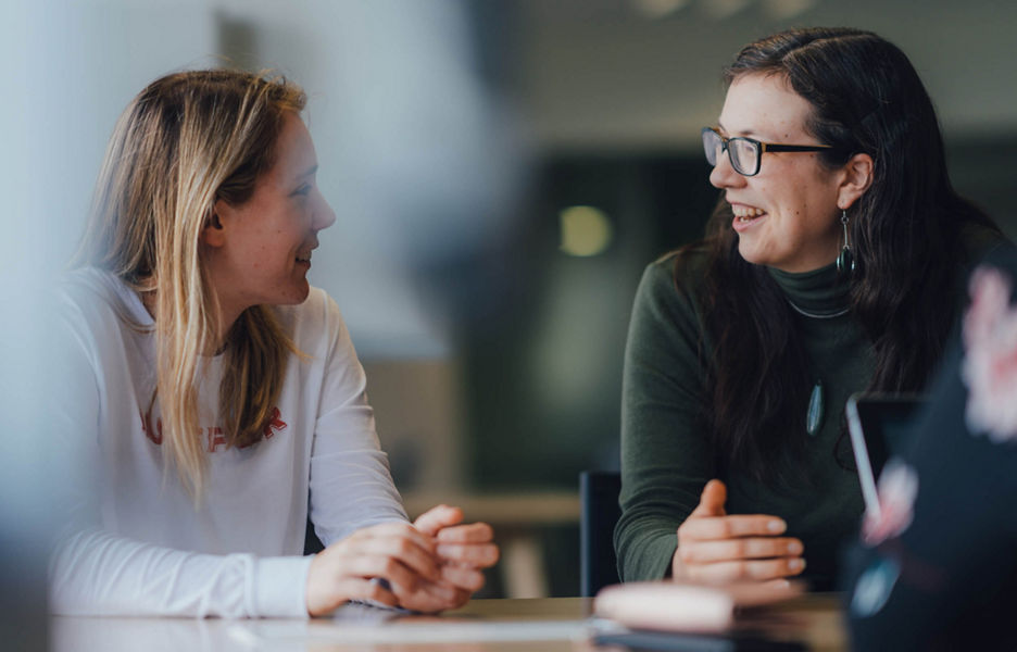 Two Datacom employees having a causal meeting