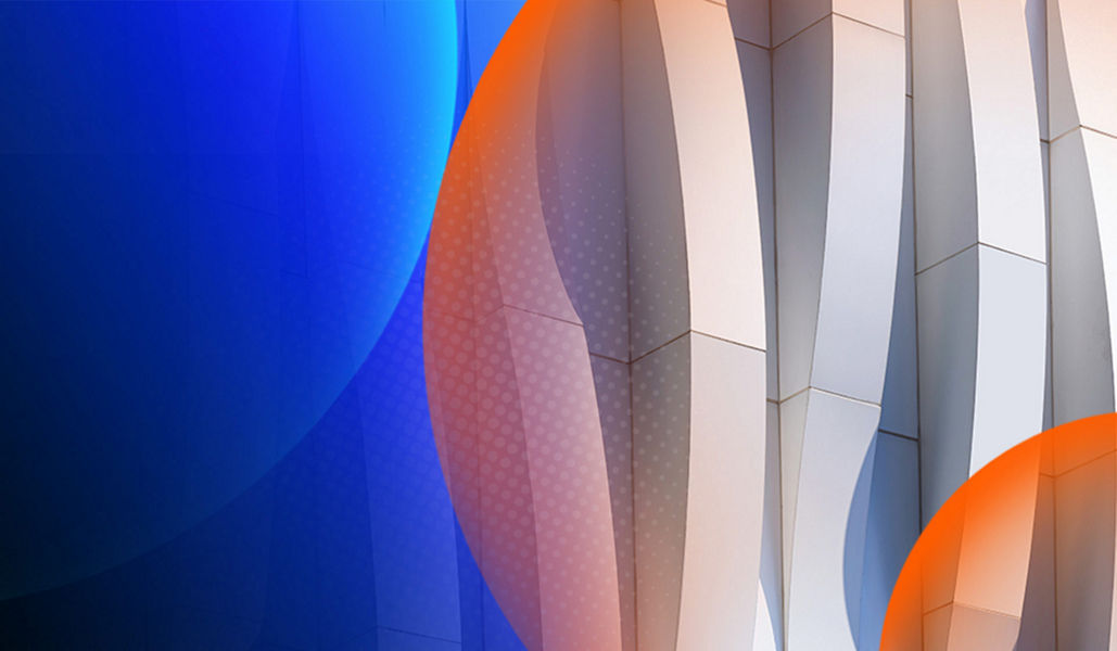 Exterior of building which is made up of an organic shaped white pattern with an orange and blue lens overlay