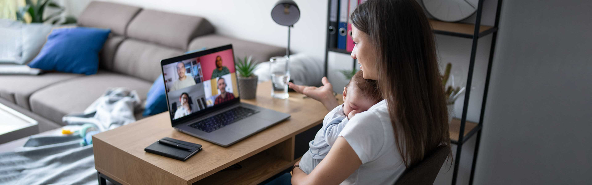 A young woman on a team call while working from home