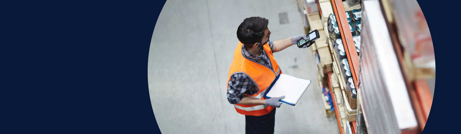 A warehouse worker scans items
