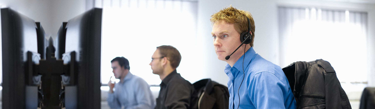 A man in an office on an IT support call
