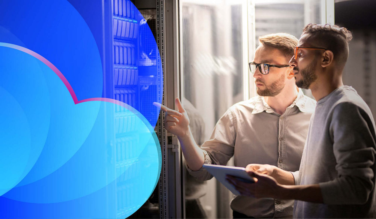 Two employees looking at a cloud server