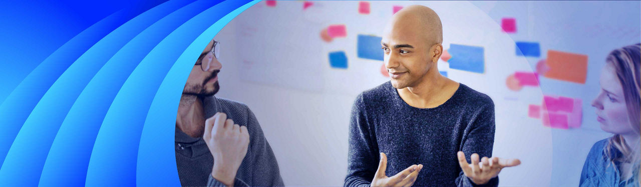 Three customer experience experts discussing sticky notes