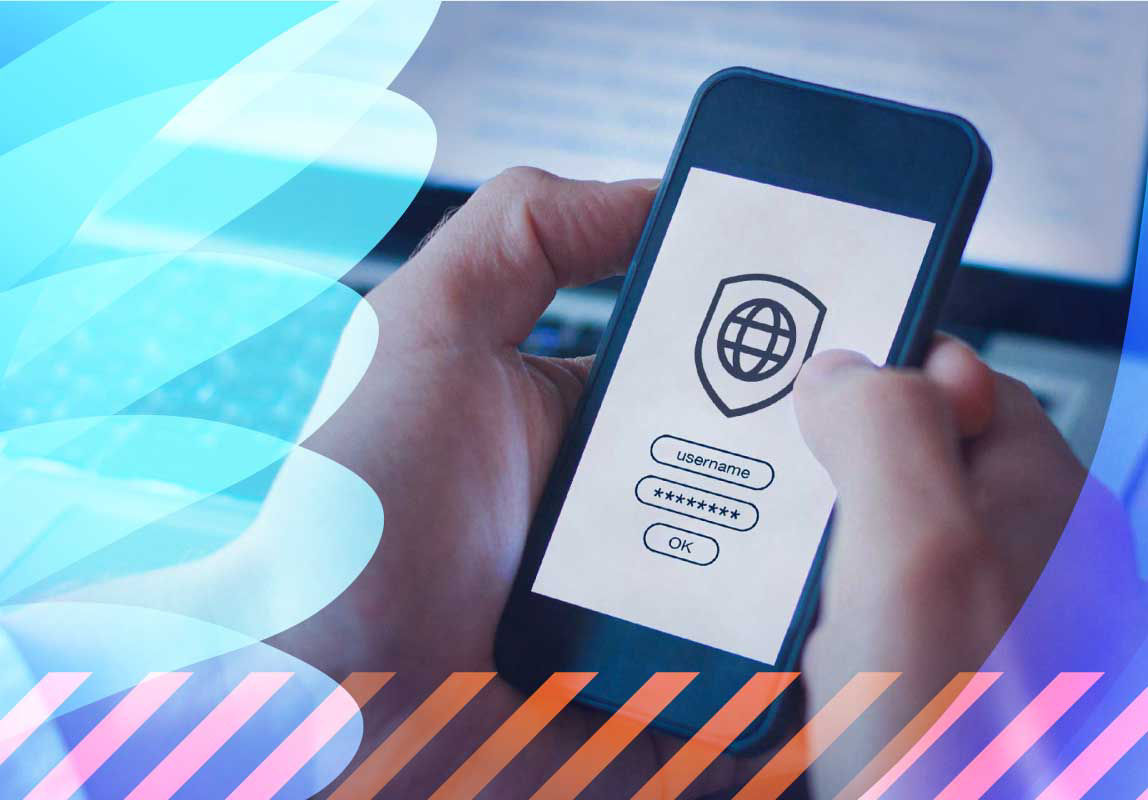 A person using a security application on a phone and laptop