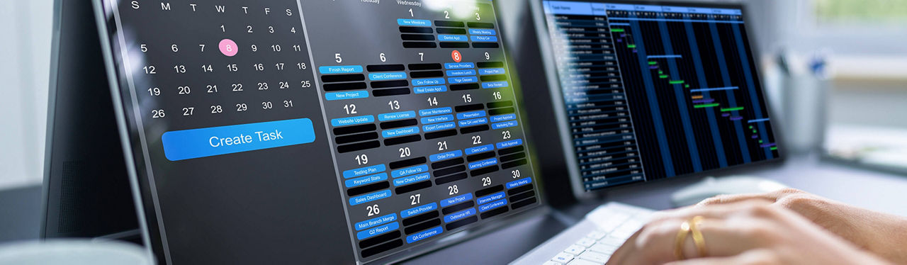 Specialist working in front of screen with calendar and timesheet